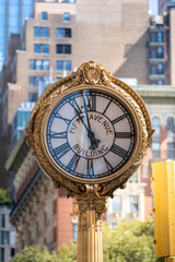 Fototapeta na wymiar Street Clock on Fifth avenue Building Golden Clock in New York City USA