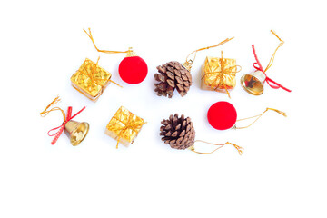 Christmas and New year decorations, Gift box, Pine cones, Golden bell and Red decoration christmas ball on white background