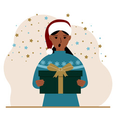 Fototapeta premium A woman with a New Year's gift. Concept of preparing for Christmas, new year, receiving a gift, christmas sale or secret santa claus.