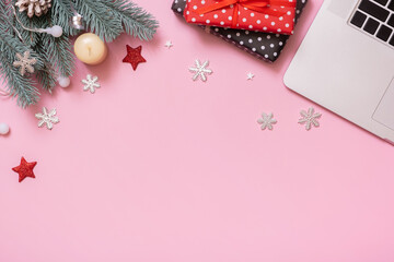 Cristmas New Year decoration on work table with copy space top view, flat lay on pink background....