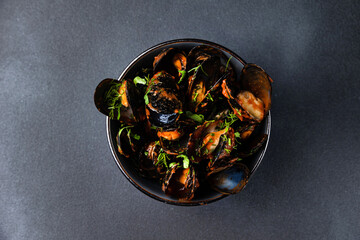 delicious mussels cooked in sauce.
