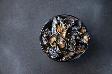 delicious mussels cooked in sauce.
