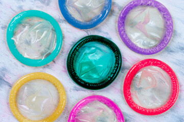 Public health, Male condoms of different colors in tight shot.