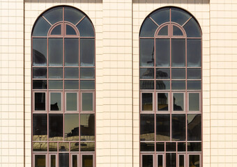 Large arched windows in the wall of the station.