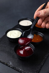 sauces of Asian cuisine on a black background
