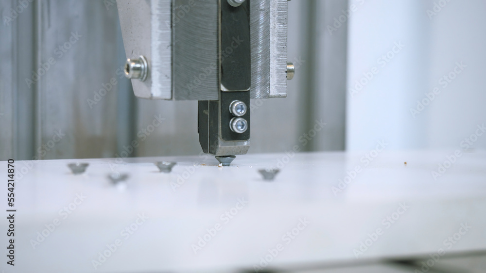 Poster machine twisting nails. media. close-up of automated machine twisting nails. production machine that