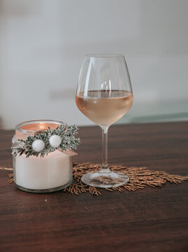 glass of champagne with a mockup candle jar, add your own text or log0