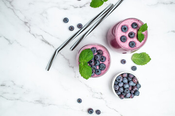 blueberry smoothie Yogurt fruit dessert on a light background. Berry smoothie. healthy dieting concept. Long banner format