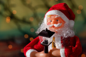 Santa Claus and Christmas puppets on abstract background with copy space