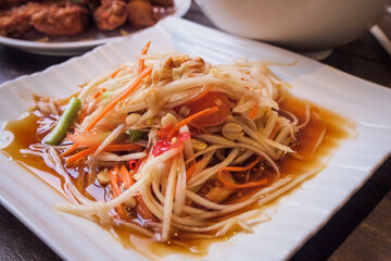 Thai papaya salad , Somtam (Street food), with roasted chicken and fresh