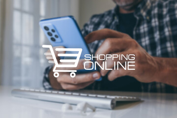 Online shopping concept. Man hands using computer and smartphone to Internet purchase.