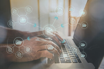 Man archiving document directory on cloud. Security backup personal documents online from laptop