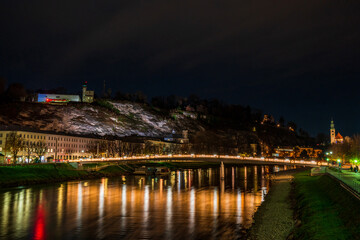Fototapeta na wymiar Night view across the River Salzach in Salzburg, Austria