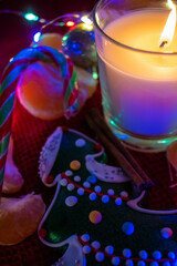 christmas composition with candles and sweets