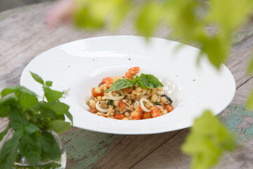 seafood risotto and wood table
