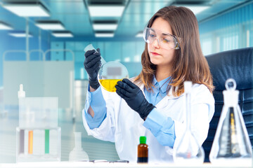 Medical woman. Nurse holds test tube with pharmacology reagent. Girl student studying pharmacology. Woman student of medical university. Research in field of pharmacology. Woman working in clinic