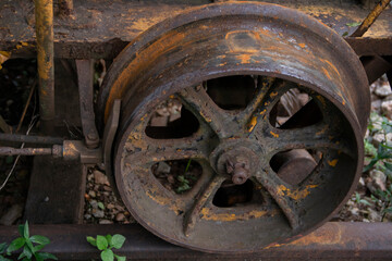 Close-up of an old tram wheel made of iron