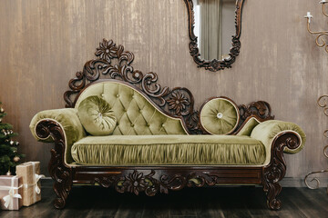 Luxurious interior in vintage style. Classic living room interior with sofa, pillows and mirror.