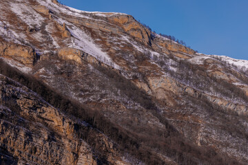 Beautiful  Mountain Landscape. Panoramic view of the snow-covered winter mountains of the Greater North Caucasus. Elbrus, Upper Balkaria, Kabardino-Balkaria, Russia.