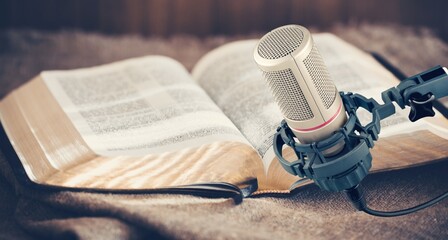 Christian concept. Bible book with microphone