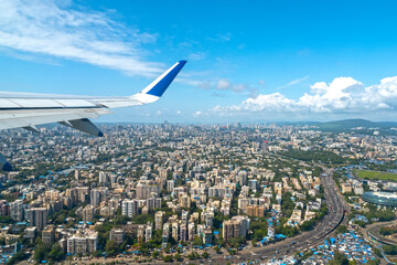 Airplane after take off and flying above Mumbai in India