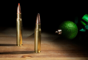Green Christmas ornament and 30-06 and 308 ammo - obrazy, fototapety, plakaty