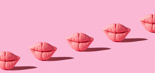 Banner with pink lips on pink background. Creative background