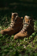 Khaki tactical military sneakers on grass