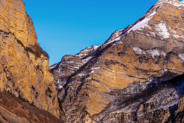 Obraz premium Beautiful Mountain Landscape. Panoramic view of the snow-covered winter mountains of the Greater North Caucasus. Elbrus, Upper Balkaria, Kabardino-Balkaria, Russia.