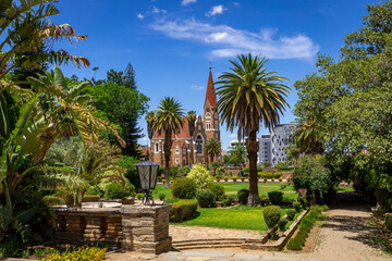 Windhoek, Namibia. Christus Kirche, or Christ Church and Parliament Gardens in Windhoek, Namibia. Africa.  - obrazy, fototapety, plakaty