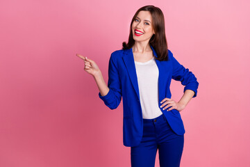 Photo of young realtor gorgeous successful business lady wear blue formal costume finger point empty space promo isolated on pink color background