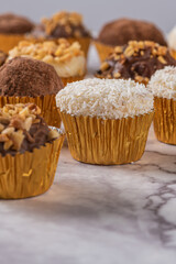 Brigadeiro is a common Brazilian dessert. Delicious chocolate candy Brigadeiro on a table
