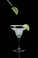 Margarita cocktail garnished with lime.
