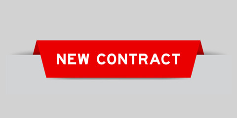 Red color inserted label with word new contract on gray background