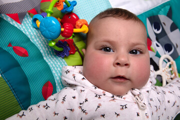 Baby girl with a toy