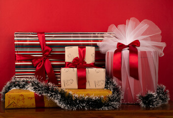 wrapped christmas gifts on Red background