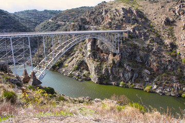 PIno bridge over Douro river, also known as Requejo iron Bridge, Castile and Leon, Spain Arribes del Duero - obrazy, fototapety, plakaty
