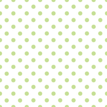 Vector seamless pattern with green polka dots on white background	