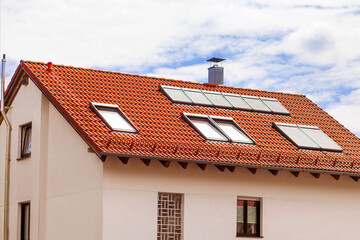 Dormers or Skylights on Attic Mansard Roof with External Roller Blinds or Shutters Outdoor of...