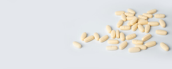 Close-up of food additive, drugs, pills, tablets, vitamins in season of colds and flu over white background. Concept of healthy lifestyle and treatment. Copy space for advertisement.