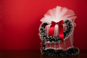 wrapped christmas gift on Red background