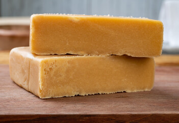 Doce de leite or dulce de leche, traditional south american milk candy over wooden board