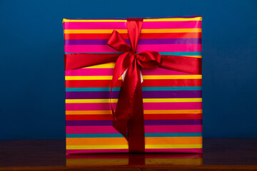 wrapped colorful gift on blue background
