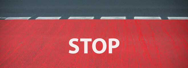 Stop is standing on the road, warning sign, take caution, finish line for a runner on the asphalt,...