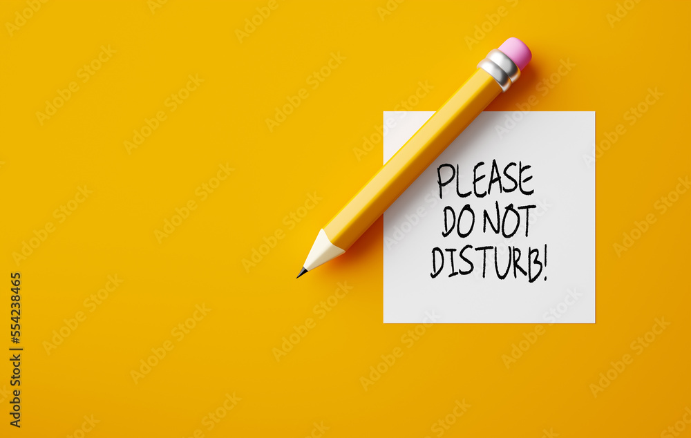 Poster pencil and a note paper with the message do not disturb on yellow background.