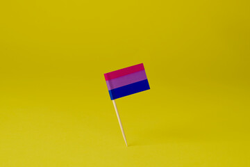 bisexual pride flag on a yellow background
