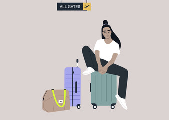 A passenger waiting for departure in the airport lounge with their cabin luggage, all gates sign hanging from the ceiling