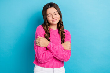 Fototapeta premium Photo of youngster teen school girl curly brown hair wear new fresh pink jumper closed eyes dreaming isolated on pastel blue color background