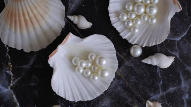 seashells full of pearls slow motion