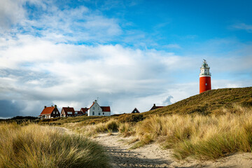 the lighthouse of the island texel in holland - obrazy, fototapety, plakaty